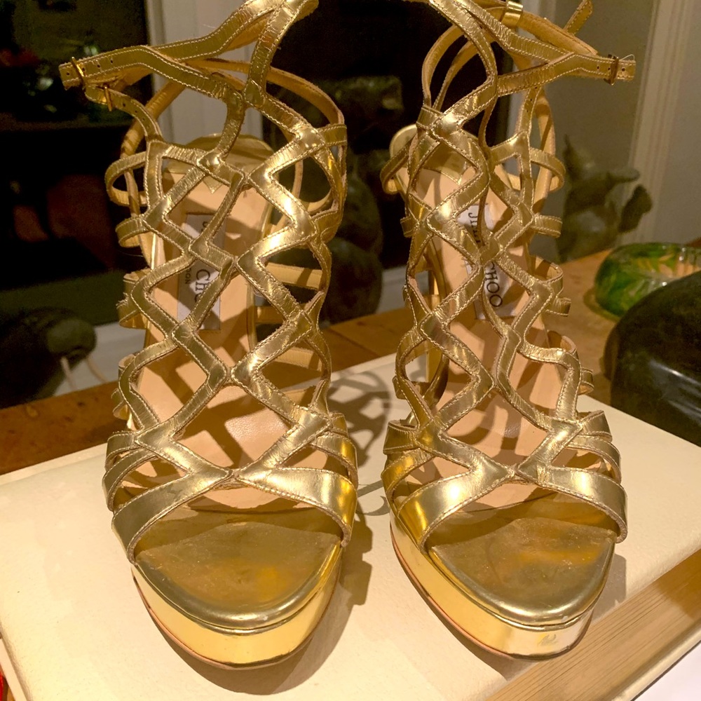 Jimmy Choo gold platform cage sandal.
